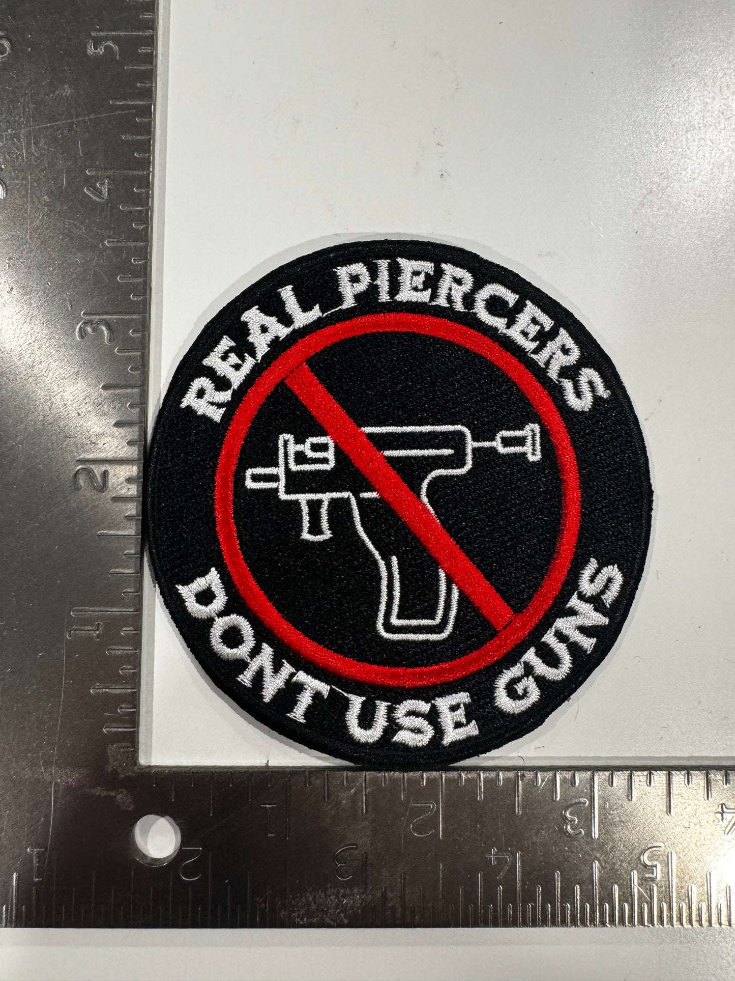 “Real Piercers Don’t Use Guns” Embroidered Patch