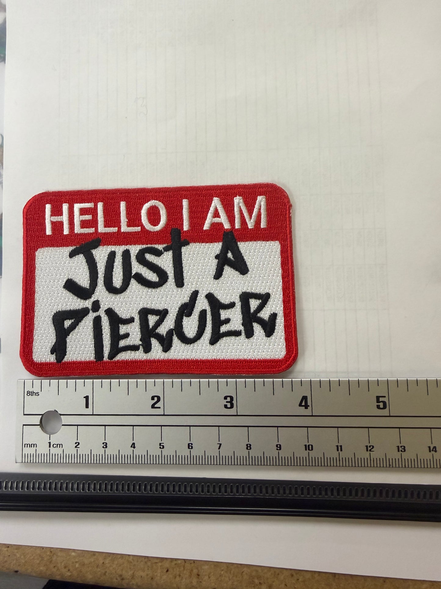 “Just a Piercer” iron on Patch